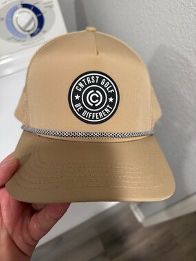 CNRST GOLF Be Different Tan Trucker Hat